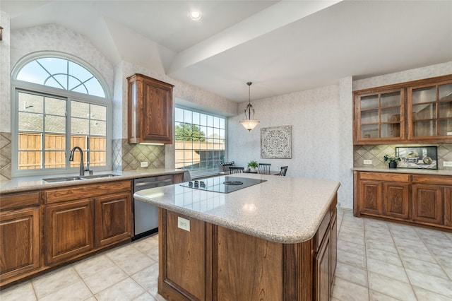 kitchen with a sink, light countertops, stainless steel dishwasher, a center island, and glass insert cabinets