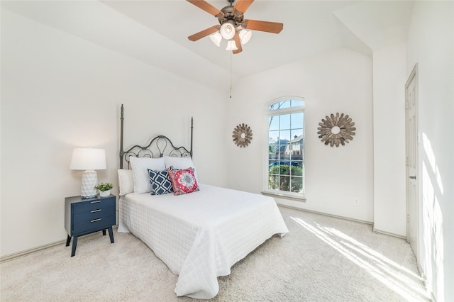 bedroom featuring a ceiling fan and light carpet