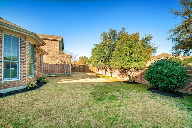 view of yard featuring a fenced backyard