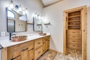 9577 Vail Eton Dr, Pilot Point, TX 76258 - full bathroom with double vanity and brick patterned floors