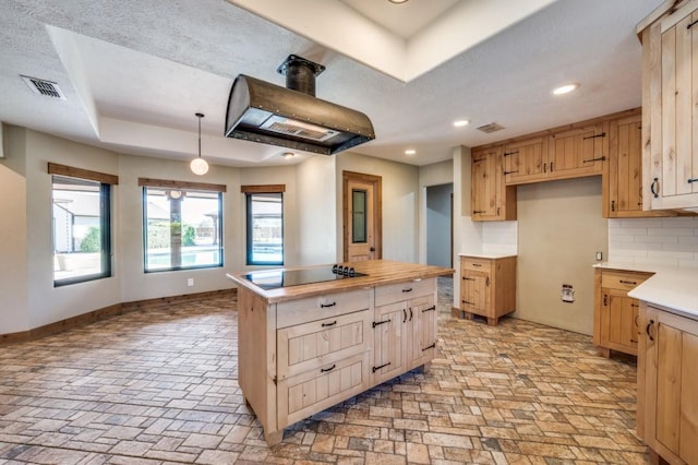 9577 Vail Eton Dr, Pilot Point, TX 76258 - kitchen with black electric stovetop, custom range hood, a kitchen island, baseboards, and recessed lighting