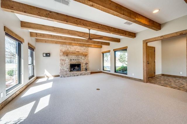 9577 Vail Eton Dr, Pilot Point, TX 76258 - unfurnished living room featuring baseboards, beamed ceiling, carpet floors, a stone fireplace, and recessed lighting