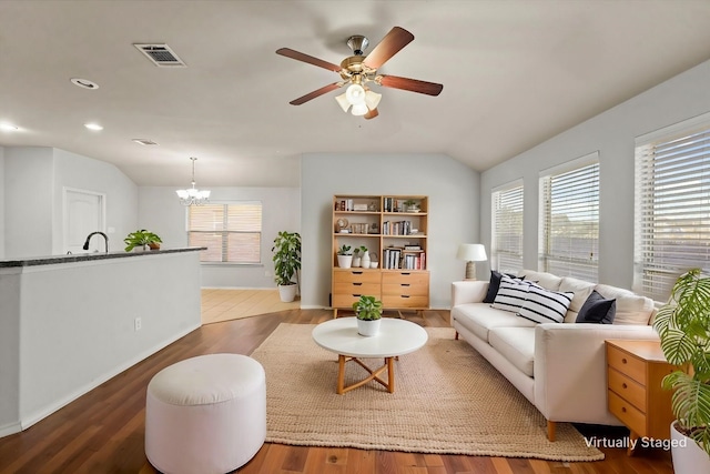 sitting room featuring visible vents, plenty of natural light, and wood finished floors