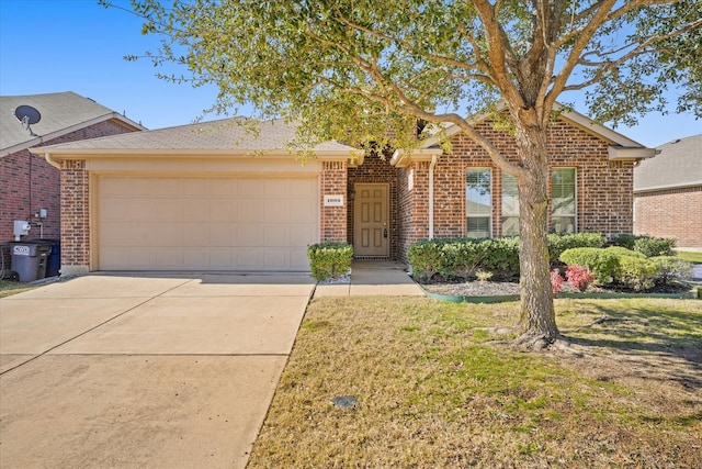 view of front of house with a front lawn, brick siding, driveway, and an attached garage