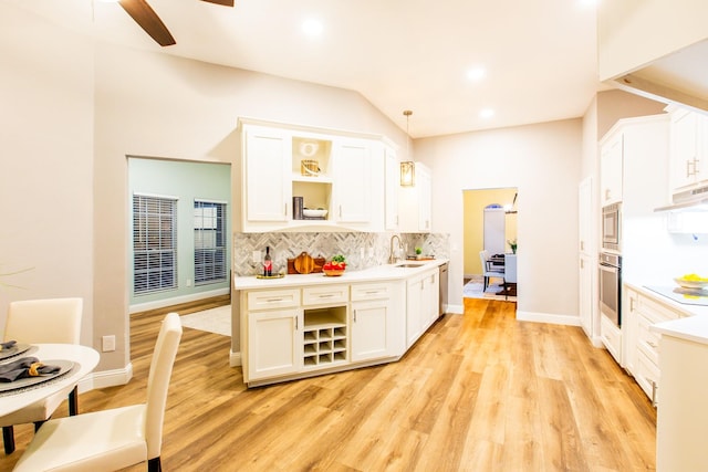 kitchen featuring pendant lighting, light countertops, and open shelves