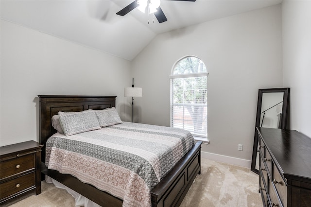 bedroom with vaulted ceiling, baseboards, a ceiling fan, and light colored carpet