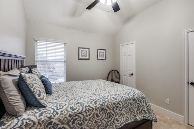 carpeted bedroom featuring vaulted ceiling, a ceiling fan, and baseboards