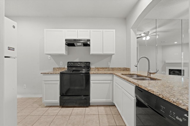 kitchen with black appliances, a sink, white cabinets, and under cabinet range hood