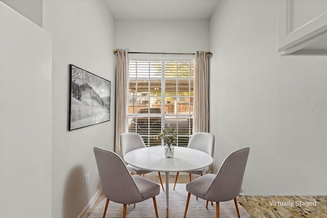 dining room with baseboards