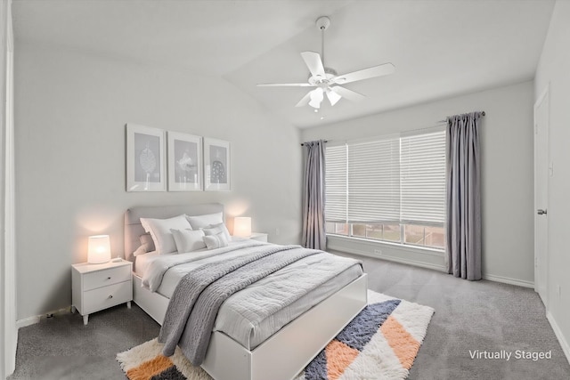 bedroom with light carpet, ceiling fan, baseboards, and vaulted ceiling