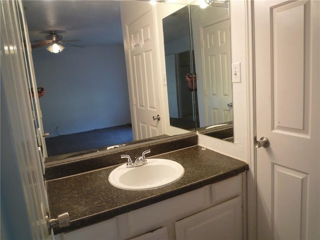 bathroom with ceiling fan and vanity