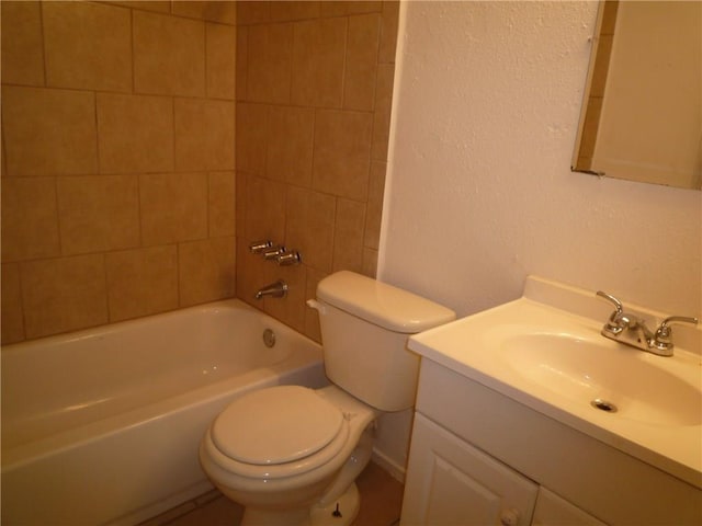 bathroom featuring shower / bath combination, a textured wall, vanity, and toilet