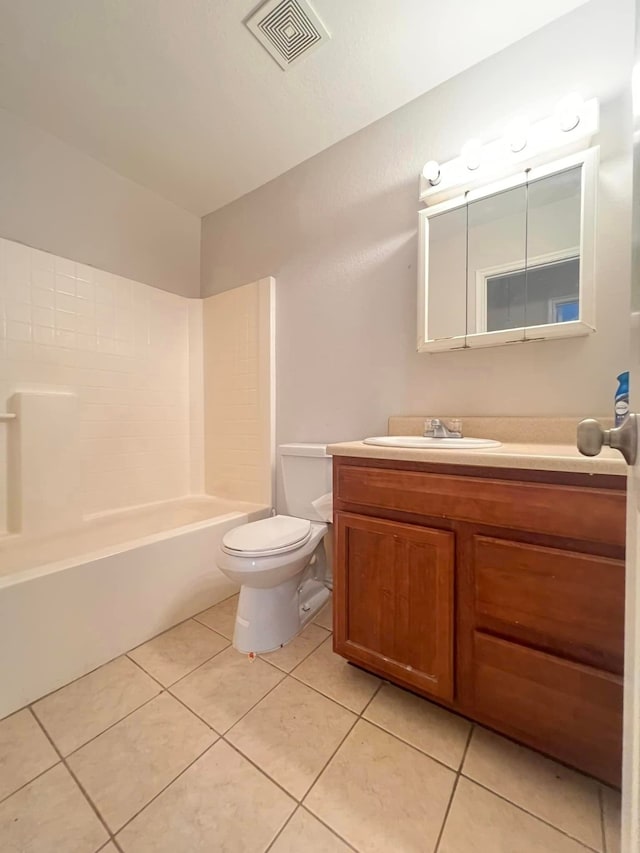 bathroom with visible vents, bathing tub / shower combination, toilet, tile patterned floors, and vanity