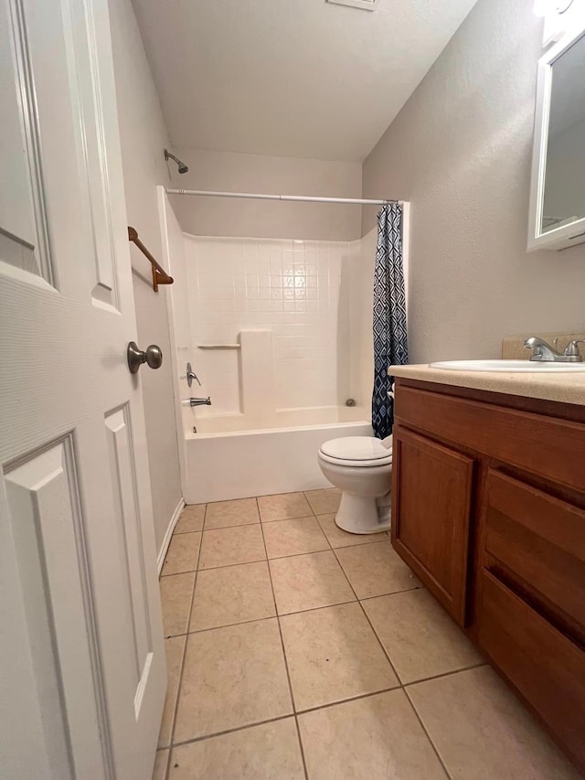 full bathroom featuring vanity, shower / bath combination with curtain, toilet, and tile patterned floors