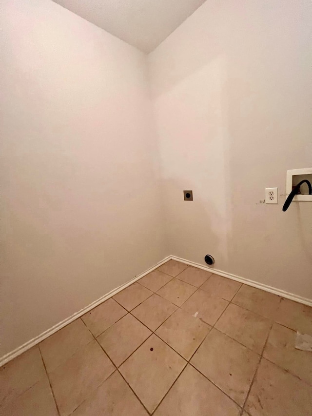 washroom with light tile patterned floors, laundry area, hookup for a washing machine, and electric dryer hookup