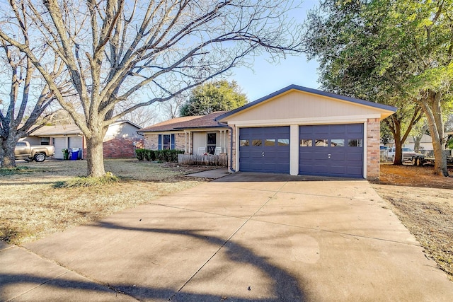 ranch-style house with an attached garage, concrete driveway, and brick siding