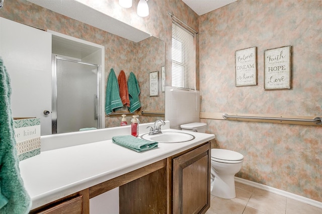 bathroom featuring a stall shower, tile patterned floors, vanity, and wallpapered walls