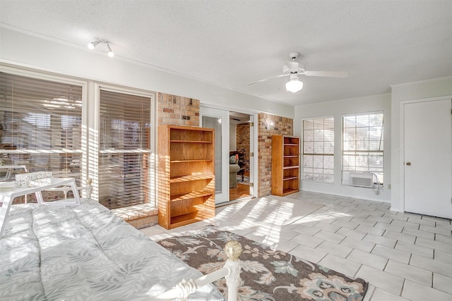 unfurnished bedroom with a textured ceiling, ceiling fan, and light tile patterned floors