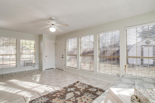 interior space with a ceiling fan and cooling unit