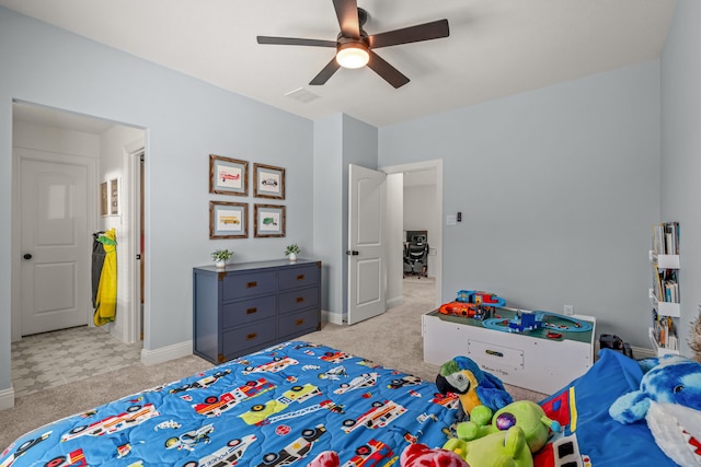 bedroom with baseboards, a ceiling fan, visible vents, and light colored carpet