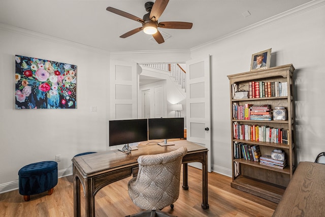 office featuring baseboards, crown molding, a ceiling fan, and wood finished floors