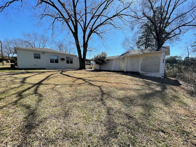 view of yard with a shed and an outbuilding