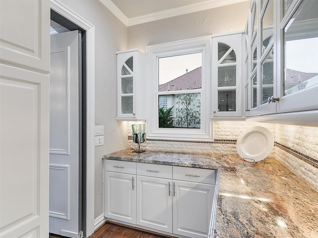 interior space featuring ornamental molding and plenty of natural light