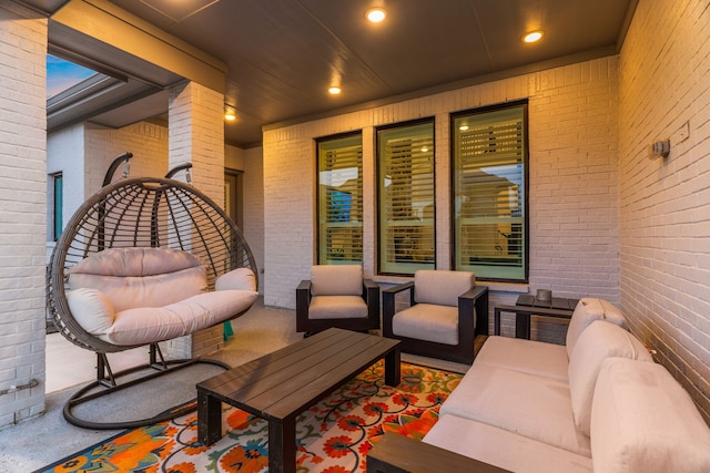 view of patio / terrace with a balcony and an outdoor living space