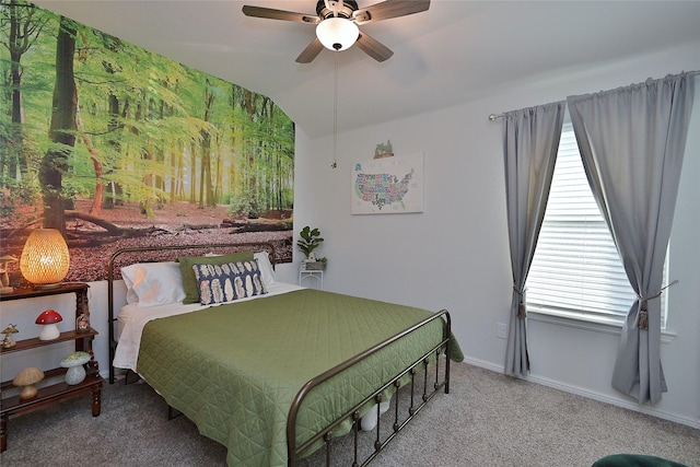 carpeted bedroom featuring lofted ceiling, baseboards, and a ceiling fan