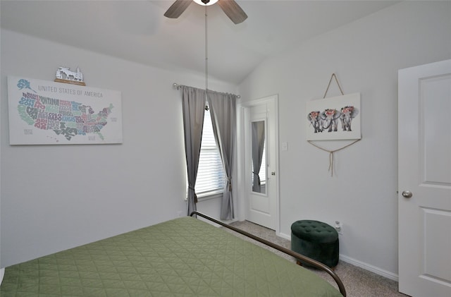 carpeted bedroom featuring a ceiling fan, vaulted ceiling, and baseboards