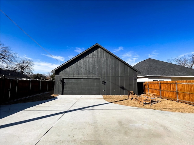 view of side of home featuring an outdoor structure and fence