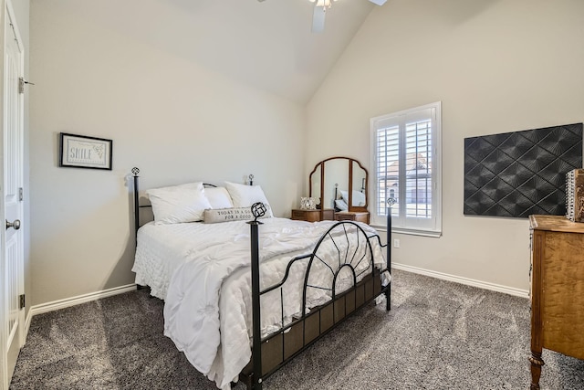 bedroom featuring lofted ceiling, dark colored carpet, a ceiling fan, and baseboards