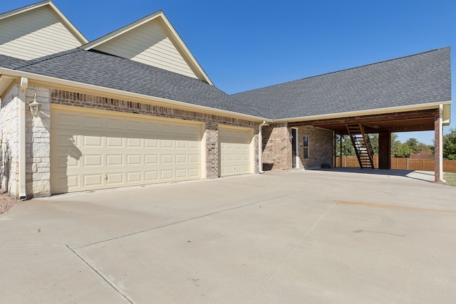 view of property exterior featuring a garage, driveway, a shingled roof, stairway, and brick siding