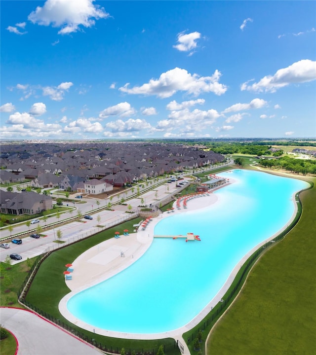 view of swimming pool featuring a residential view