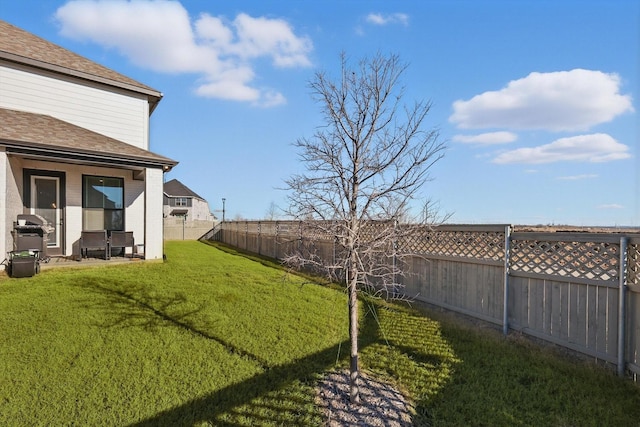 view of yard with a fenced backyard