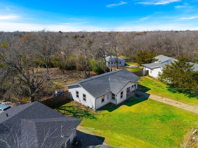 birds eye view of property with a wooded view