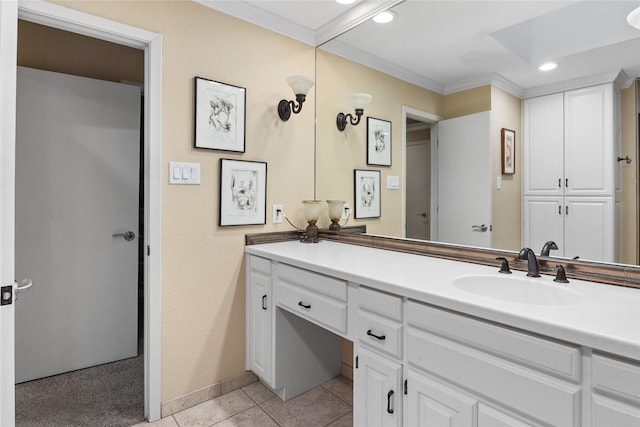 bathroom with tile patterned flooring, recessed lighting, vanity, baseboards, and ornamental molding