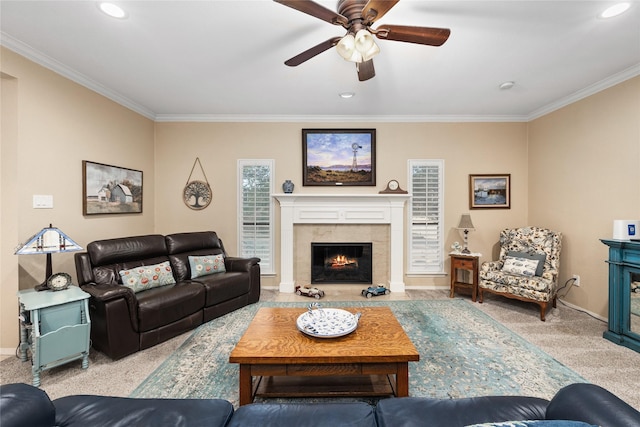 living area with recessed lighting, light colored carpet, crown molding, and a tiled fireplace