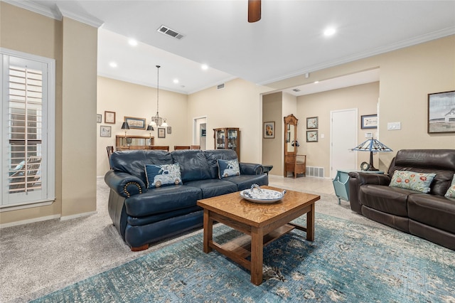 living area featuring carpet floors, visible vents, crown molding, and baseboards