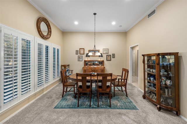 carpeted dining space featuring recessed lighting, visible vents, and ornamental molding