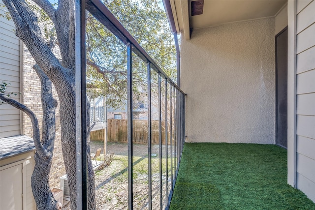 exterior space with brick siding and stucco siding