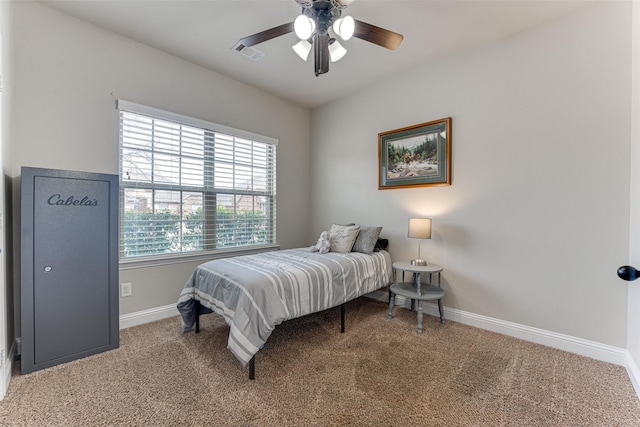 bedroom with a ceiling fan, baseboards, visible vents, and carpet flooring