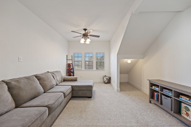 living area featuring light carpet, ceiling fan, and baseboards