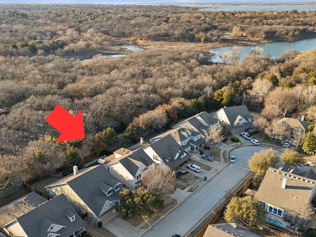 bird's eye view featuring a water view and a residential view