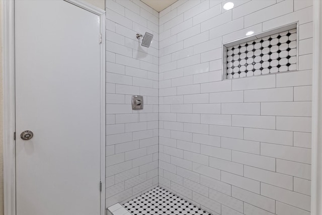 full bathroom with tiled shower