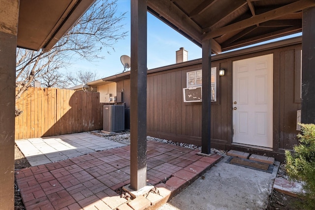 view of patio / terrace with fence and central AC unit