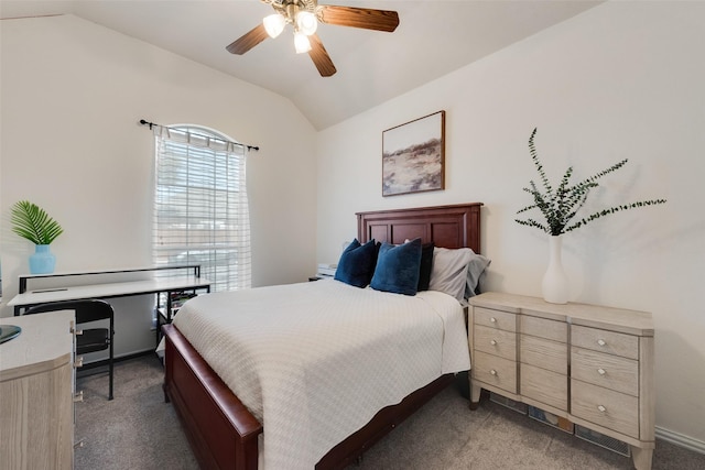 bedroom with lofted ceiling, baseboards, dark colored carpet, and a ceiling fan