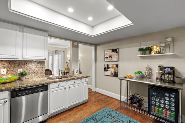 10211 Regal Oaks Dr Unit 121, Dallas, TX 75230 - kitchen featuring dishwasher, a sink, white cabinetry, and light wood-style floors