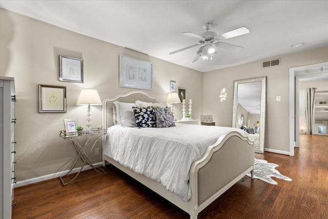 10211 Regal Oaks Dr Unit 121, Dallas, TX 75230 - bedroom with baseboards, wood finished floors, and a ceiling fan