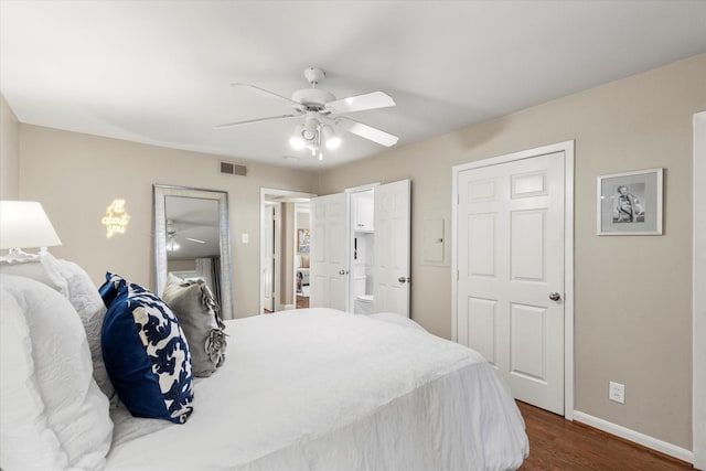 10211 Regal Oaks Dr Unit 121, Dallas, TX 75230 - bedroom featuring dark wood-type flooring, baseboards, and a ceiling fan